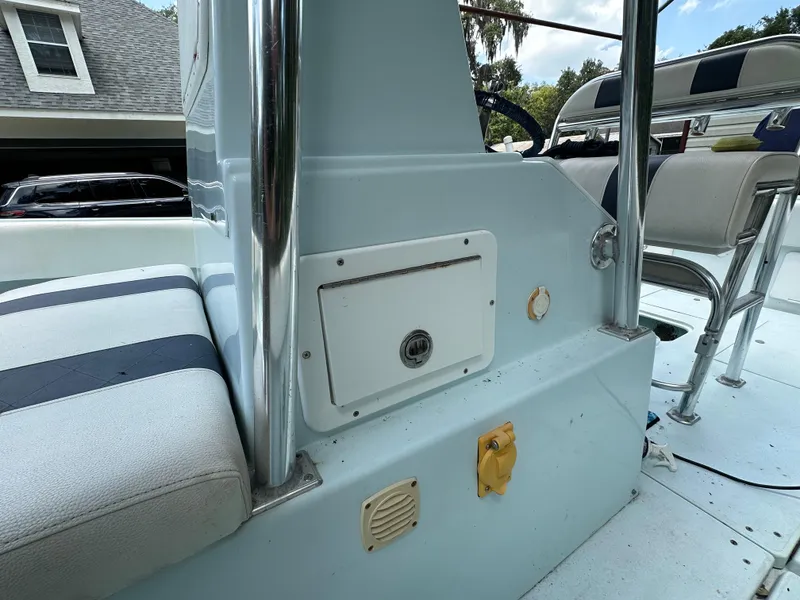 Slide: The Image of 1985 Contender 25 Classic boat interior with seating and storage compartment. - 20