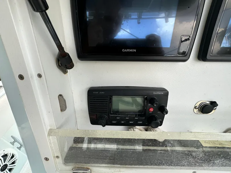 Slide: The Image of Control panel of a 1985 Contender 25 Classic boat with Garmin electronics. - 32