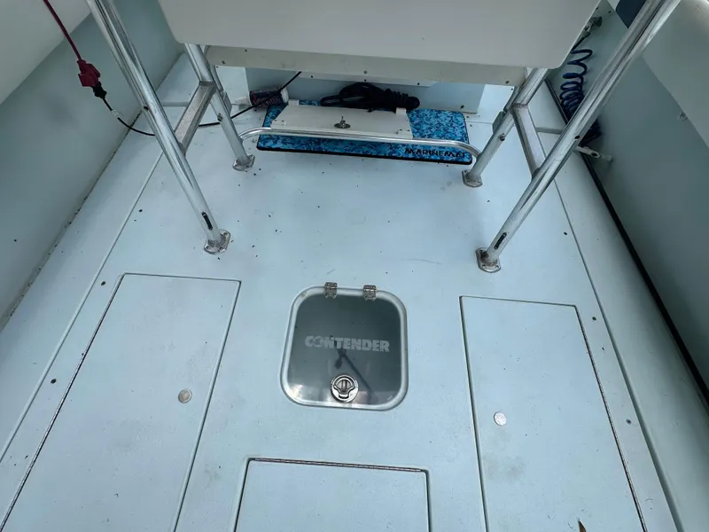 Slide: The Image of 1985 Contender 25 Classic boat deck with storage compartments and seating area. - 40