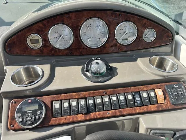 Slide: The Image of Dashboard of 2013 Rinker 290 Express Cruiser with gauges and controls. - 31