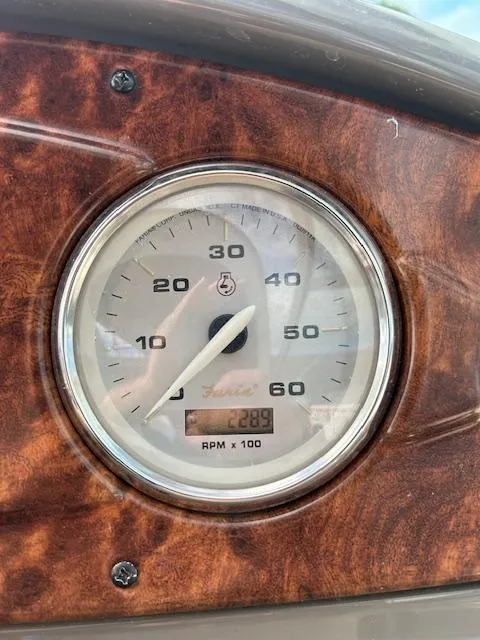 Slide: The Image of Close-up of 2013 Rinker 290 Express Cruiser tachometer displaying 289 RPM. - 33