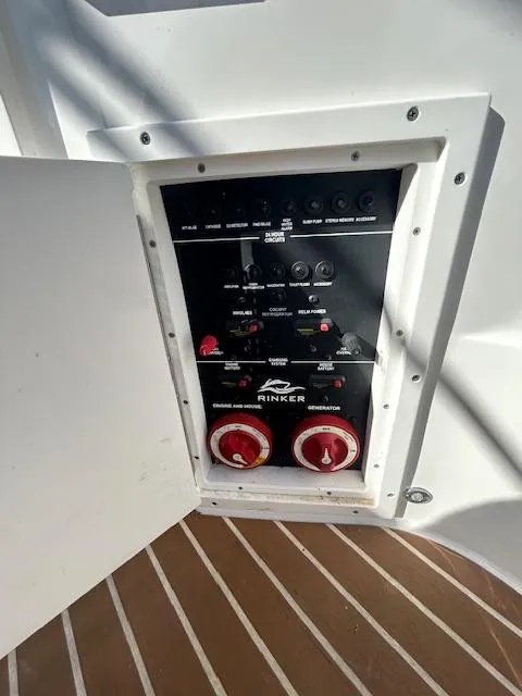 Slide: The Image of Electrical panel of 2013 Rinker 290 Express Cruiser with open access door. - 39