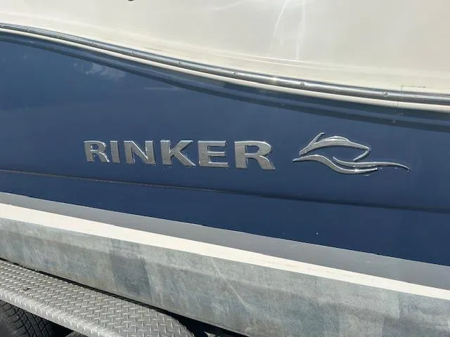 Slide: The Image of 2013 Rinker 290 Express Cruiser boat side view with logo and emblem. - 6