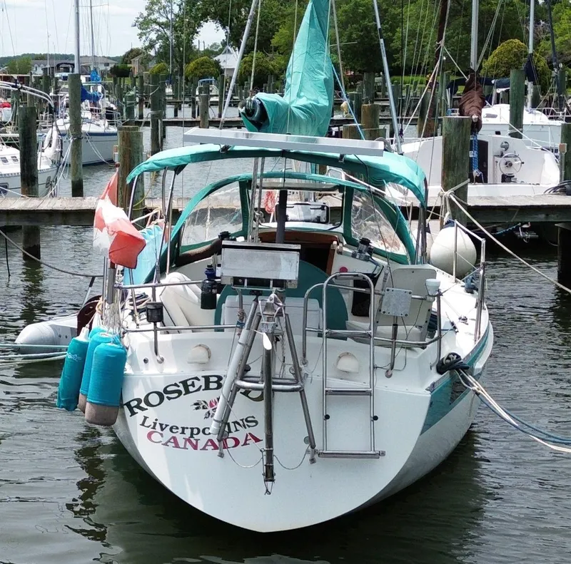 Slide: The Image of Sailboat "Rosebud" docked, Scanmar 33, 1986 model, Liverpool, Canada flag displayed. - 5