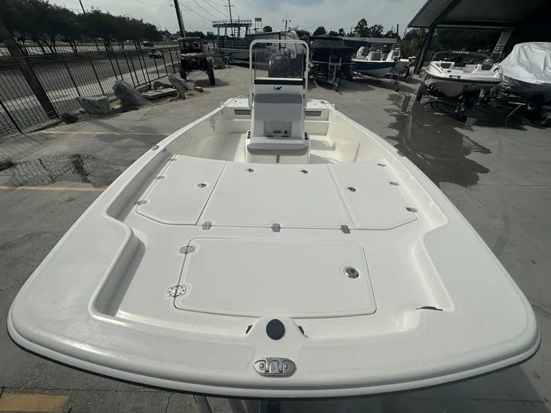 Slide: The Image of 2024 Mako Pro Skiff 19 CC boat, spacious deck, center console, outdoor display. - 11