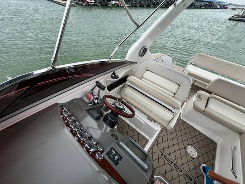 Slide: The Image of Cockpit view of 2011 Regal 35 Express Cruiser with steering wheel and seating. - 15