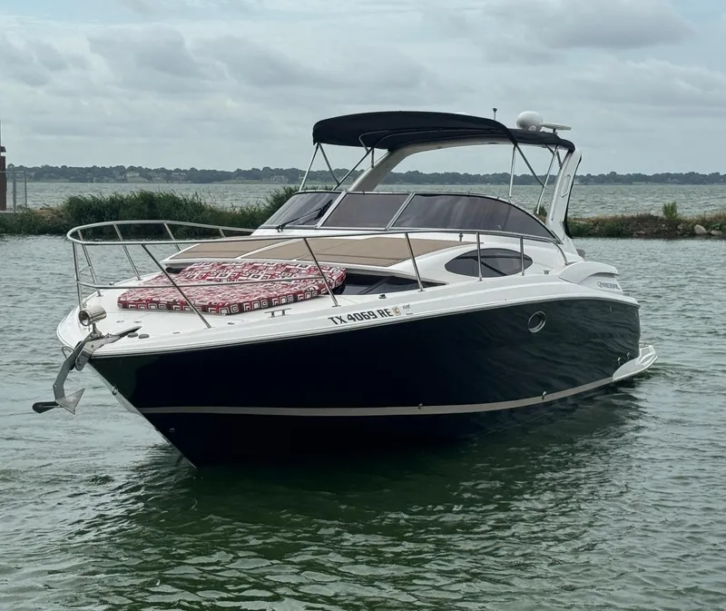 Slide: The Image of 2011 Regal 35 Express Cruiser on calm water, overcast sky. - 2