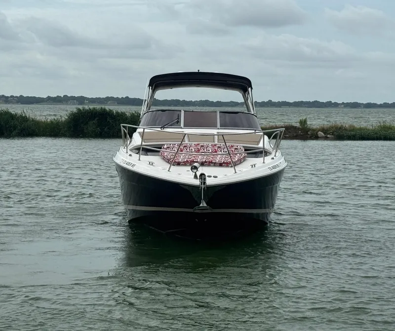 Slide: The Image of 2011 Regal 35 Express Cruiser on calm water, front view. - 3