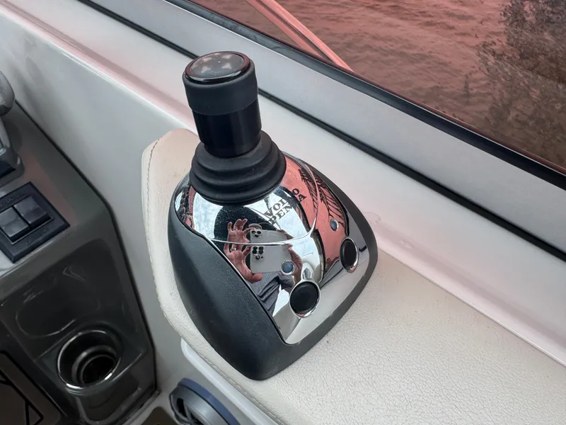 Slide: The Image of Joystick control on 2011 Regal 35 Express Cruiser boat dashboard. - 30