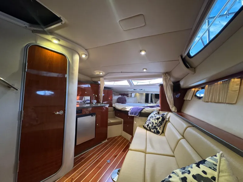 Slide: The Image of Luxurious interior of a 2011 Regal 35 Express Cruiser with modern amenities and elegant design. - 32