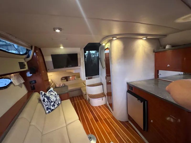 Slide: The Image of Interior of 2011 Regal 35 Express Cruiser with modern amenities and stylish design. - 40