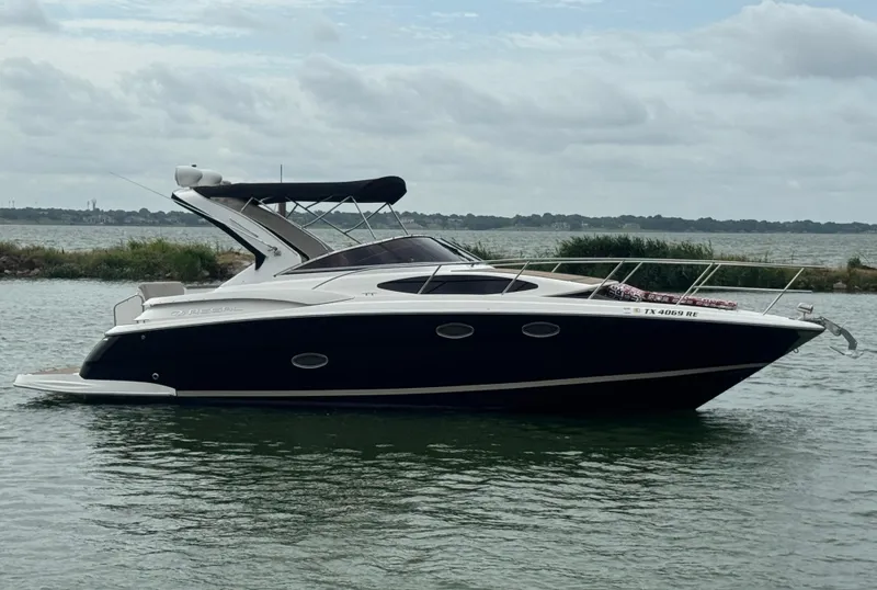 Slide: The Image of 2011 Regal 35 Express Cruiser on calm water, side view. - 5