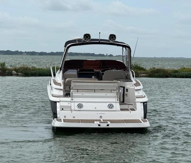 Slide: The Image of 2011 Regal 35 Express Cruiser on calm water, rear view. - 7