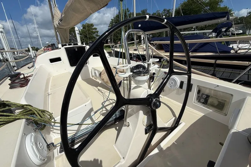 Slide: The Image of 2005 J Boats J/124 sailboat cockpit with steering wheel and navigation instruments. - 10
