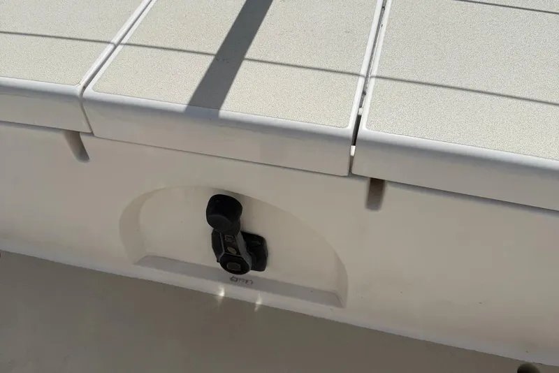 Slide: The Image of 2005 J Boats J/124 deck detail with latch and textured surface. - 21