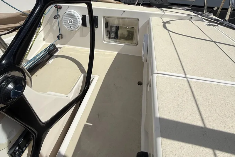 Slide: The Image of 2005 J Boats J/124 cockpit with steering wheel and control panel. - 24
