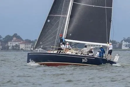 Slide: The Image of 2005 J Boats J/124 sailing on a calm sea with crew onboard. - 4