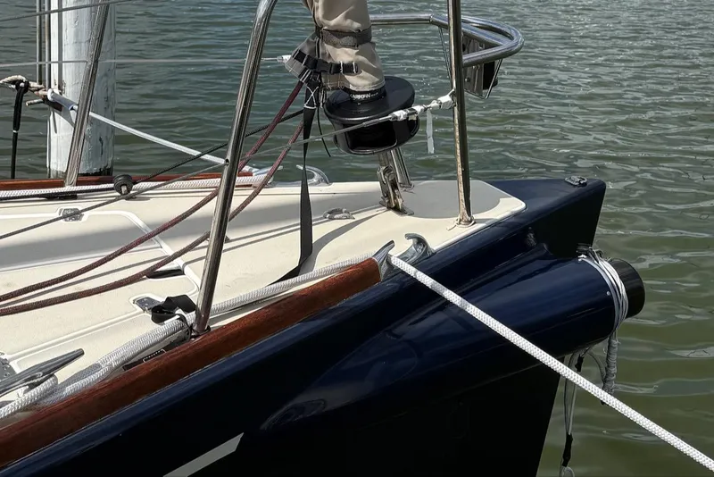 Slide: The Image of Bow of 2005 J Boats J/124 sailboat with ropes and fittings on water. - 8