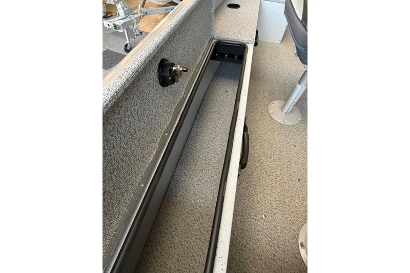 Slide: The Image of 2025 Lund 1675 Alaskan SS boat interior with storage compartment and seating. - 11