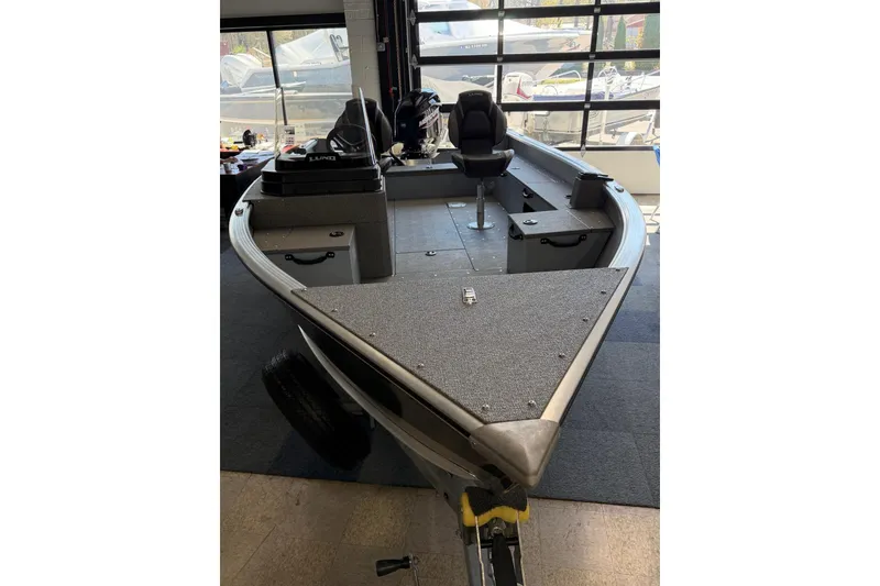 Slide: The Image of 2025 Lund 1675 Alaskan SS boat interior with seating and storage compartments. - 9