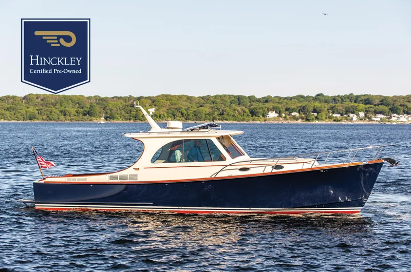 Slide: The Image of 2018 Hinckley Picnic Boat 37 MKIII cruising on water, certified pre-owned. - 0