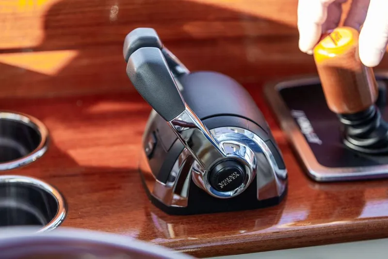 Slide: The Image of Throttle control of 2018 Hinckley Picnic Boat 37 MKIII on polished wooden dashboard. - 42