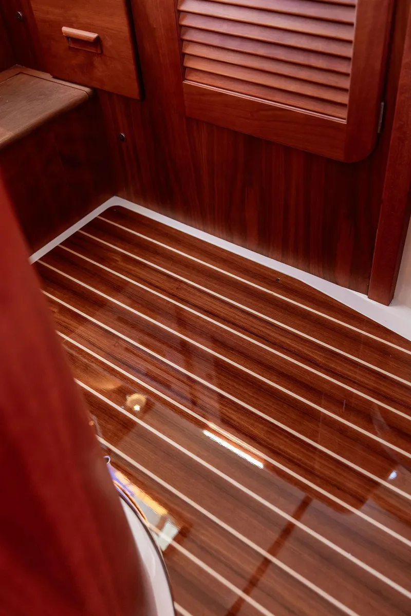Slide: The Image of Hinckley Picnic Boat 37 MKIII 2018 interior with polished wooden flooring. - 46
