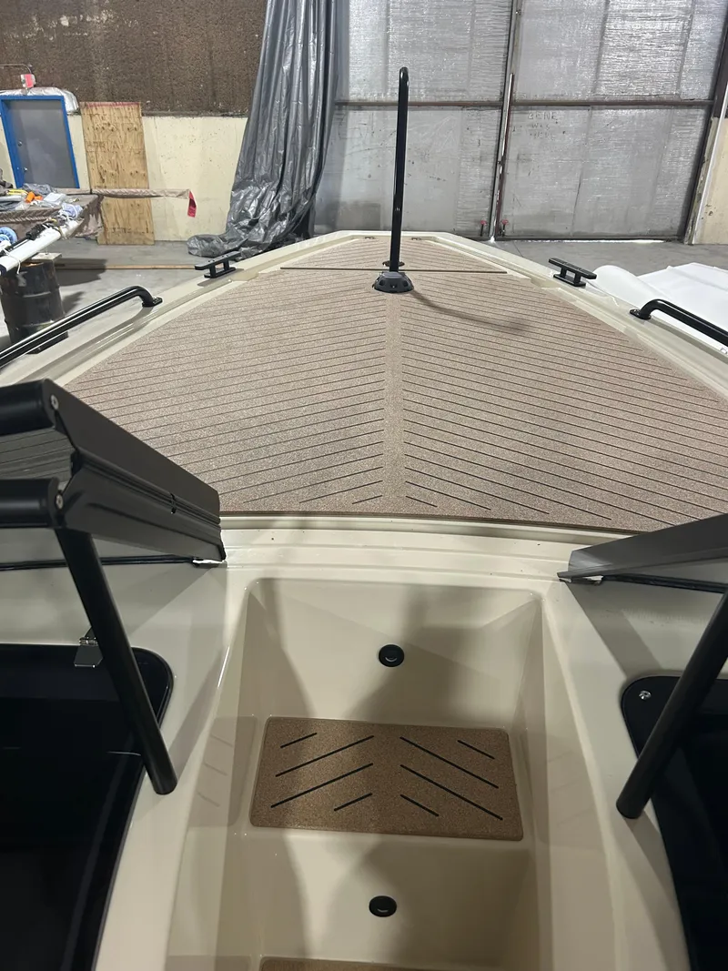 Slide: The Image of 2024 X Shore 1 boat interior with modern design and sleek deck features. - 13