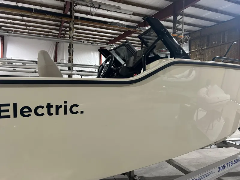 Slide: The Image of 2024 X Shore 1 electric boat in a warehouse setting. - 3