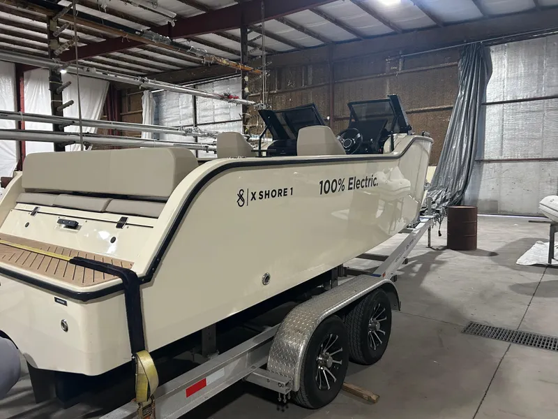 Slide: The Image of 2024 X Shore 1 electric boat on trailer in warehouse setting. - 5