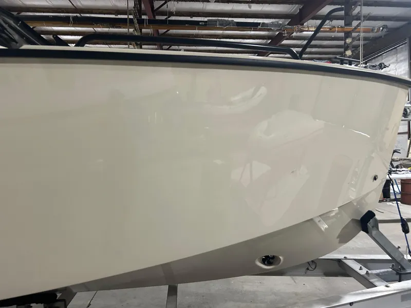 Slide: The Image of 2024 X Shore 1 boat hull in a warehouse setting. - 6