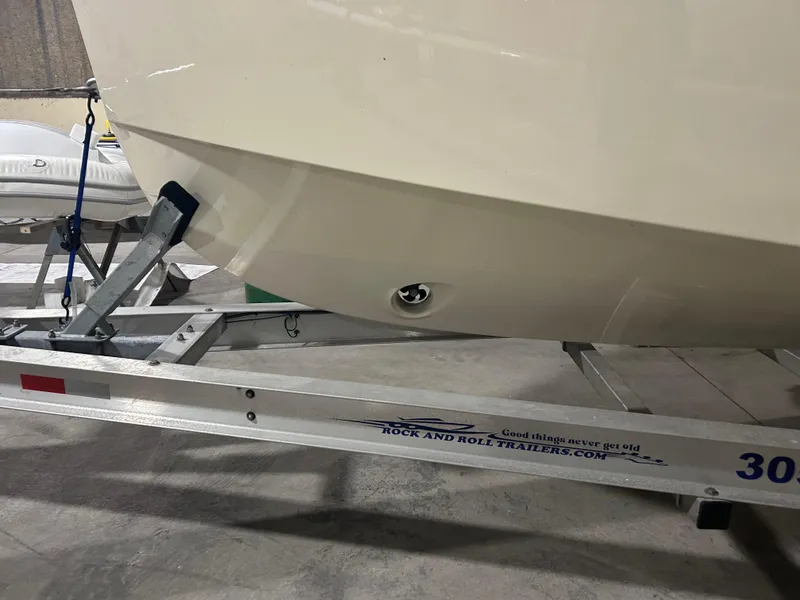 Slide: The Image of 2024 X Shore 1 boat on trailer, showcasing hull and trailer details. - 7