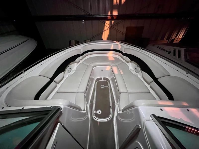 Slide: The Image of 2003 Chaparral 260 SSi boat interior with white seating and sleek design. - 6