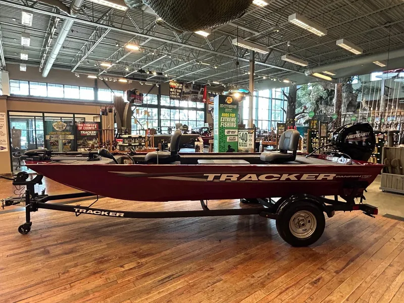 Slide: The Image of 2025 Tracker Panfish 17 boat displayed indoors on a wooden floor. - 37