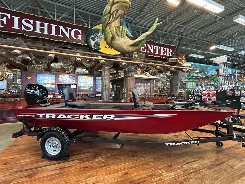 Slide: The Image of 2025 Tracker Panfish 17 boat displayed in a fishing center showroom. - 38