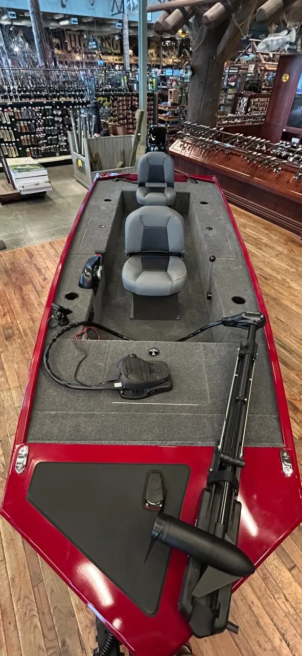 Slide: The Image of 2025 Tracker Panfish 17 boat with dual seats, displayed indoors on wooden flooring. - 41