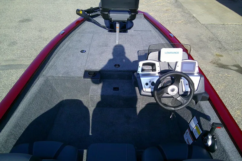 Slide: The Image of 2025 Tracker Pro Team 175 boat interior with steering console and Lowrance electronics. - 6