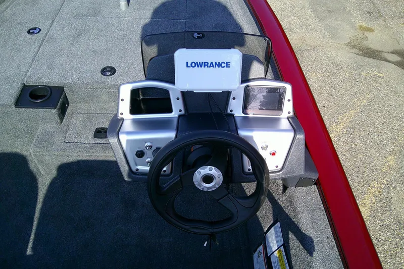 Slide: The Image of 2025 Tracker Pro Team 175 boat dashboard with Lowrance electronics and steering wheel. - 7