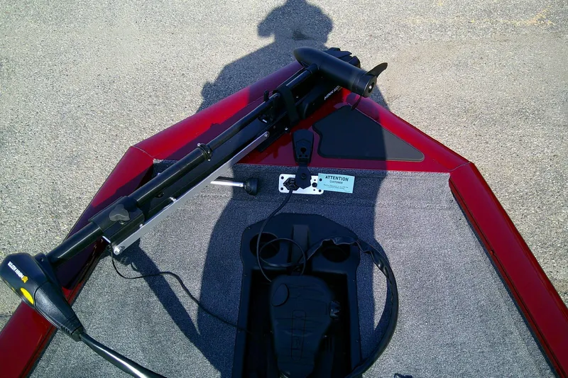 Slide: The Image of 2025 Tracker Pro Team 175 boat deck with trolling motor and control panel. - 8