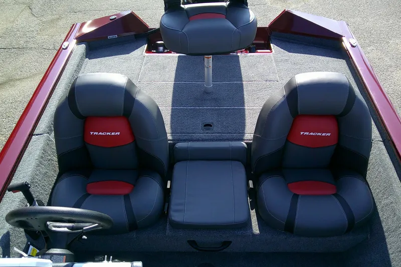 Slide: The Image of 2025 Tracker Pro Team 175 boat interior with gray and red seating. - 9