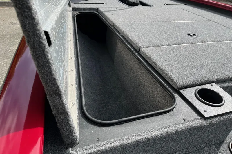 Slide: The Image of 2025 Tracker Pro Team 195 Tournament Edition boat storage compartment, open lid view. - 10