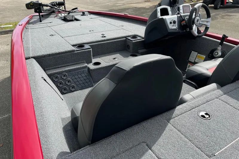 Slide: The Image of 2025 Tracker Pro Team 195 Tournament Edition boat interior with steering console and seating. - 33
