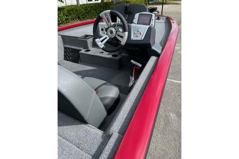 Slide: The Image of 2025 Tracker Pro Team 195 Tournament Edition boat interior with steering wheel and controls. - 6