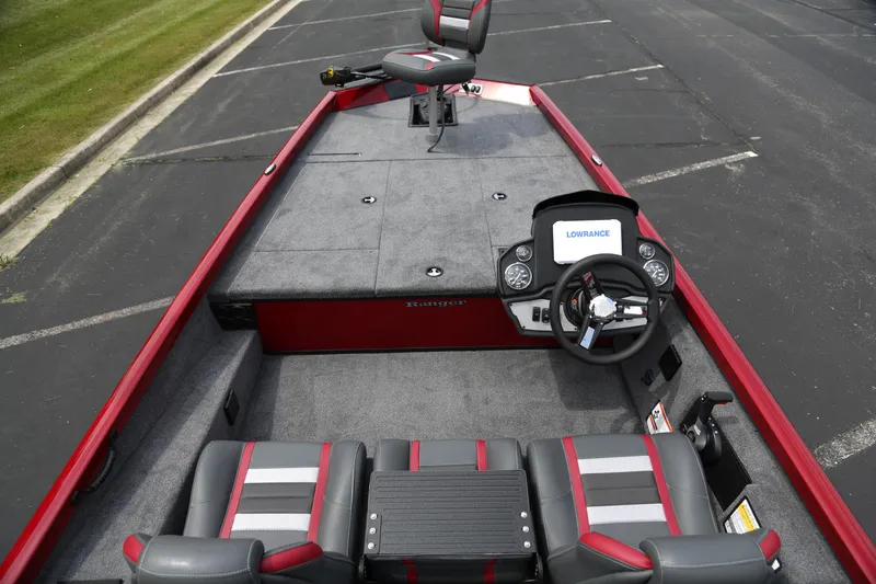 Slide: The Image of 2025 Ranger RT188 boat interior with steering wheel and seating, featuring red and gray accents. - 4