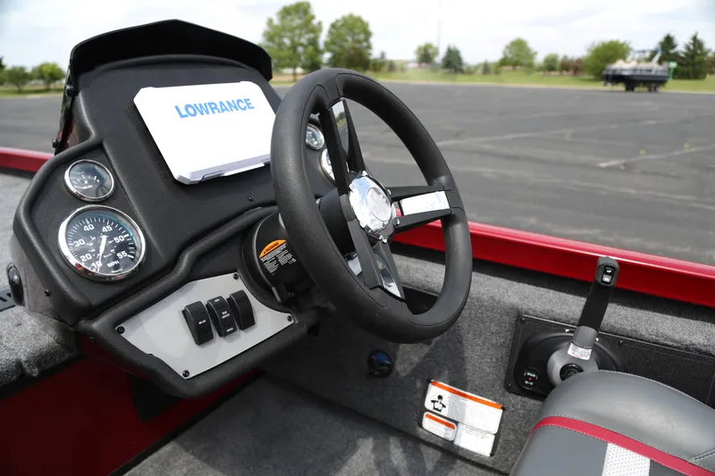 Slide: The Image of 2025 Ranger RT188 boat dashboard with steering wheel and Lowrance navigation system. - 5