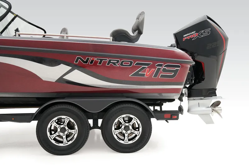 Slide: The Image of 2025 Nitro ZV19 Pro boat interior with steering wheel and dashboard in showroom. - 35