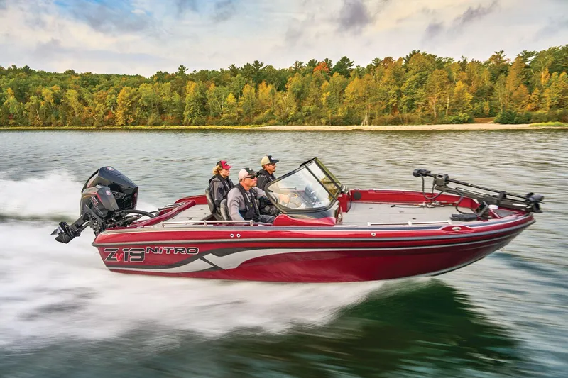 Slide: The Image of 2025 Nitro ZV19 Pro boat displayed indoors with powerful outboard motor. - 43