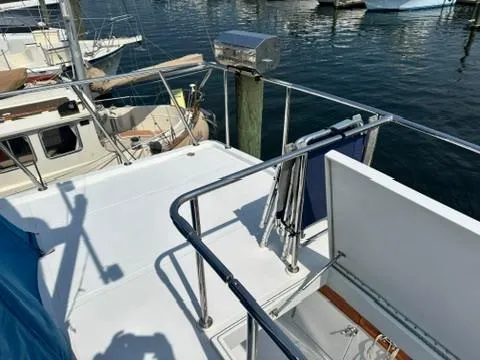 Slide: The Image of 2009 Marine Trader 36 Euro Sedan yacht deck with railing, docked at marina. - 17