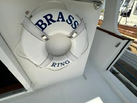 Slide: The Image of Life preserver labeled "Brass Ring" on 2009 Marine Trader 36 Euro Sedan boat. - 19
