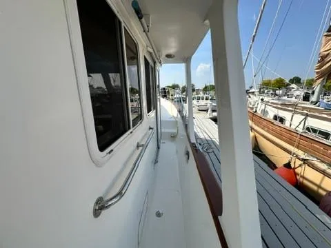 Slide: The Image of Side view of 2009 Marine Trader 36 Euro Sedan docked at marina. - 23